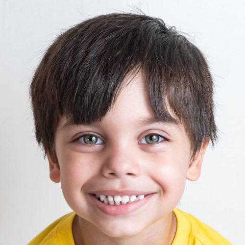 Cute and happy boy with yellow t-shirt