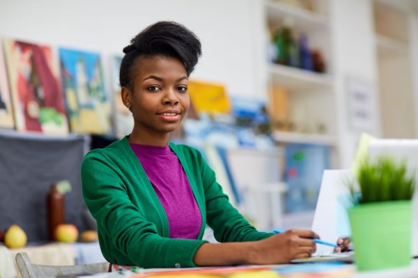 African-american designer working in fashion studio