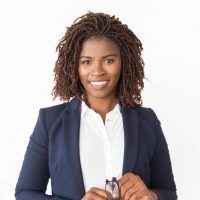 Happy successful manager holding glasses. Young African American business woman standing isolated over white background, looking at camera, smiling. Glasses wearer concept